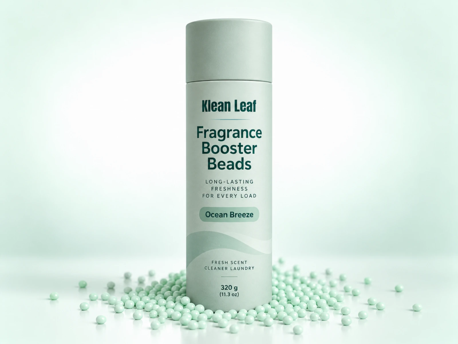 Klean Leaf fragrance booster beads in a pale green cylindrical container labeled Ocean Breeze, surrounded by pale green beads