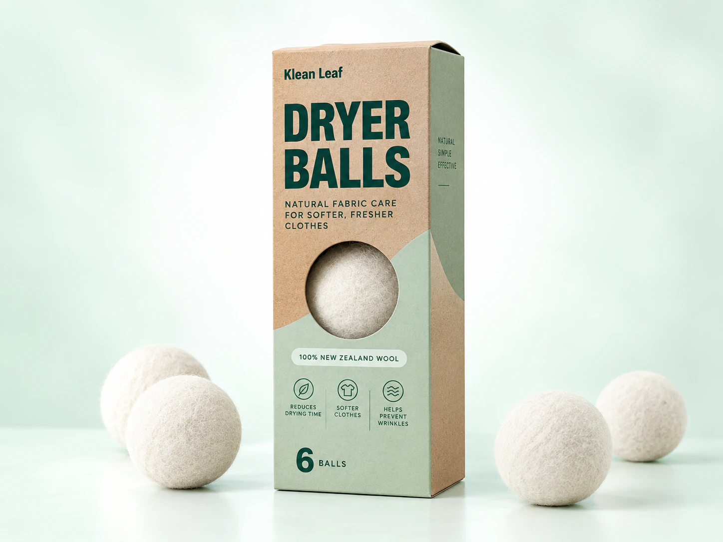 Klean Leaf wool dryer balls in a kraft and pale green box with loose white wool balls