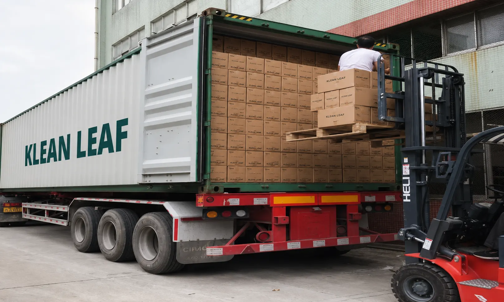 Klean Leaf cartons being loaded into a shipping container for logistics coordination